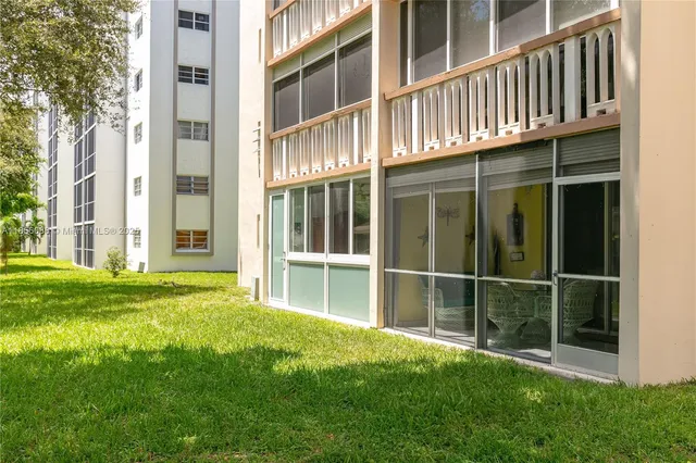 front view of a building with a yard