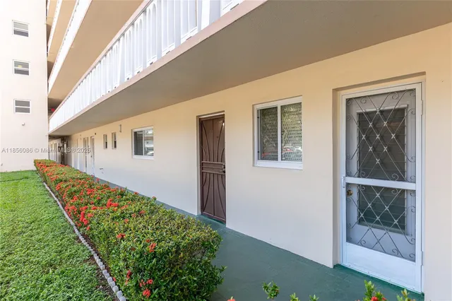 a hallway with a table and chair