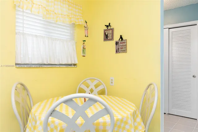 a bedroom with a bed a stove and a chandelier