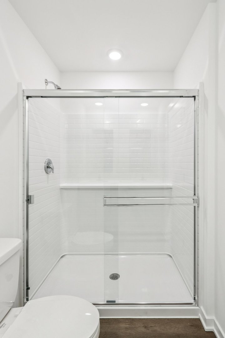 385 Summit Circle Lombard, IL 60148 - Photo 19 of 40 a bathroom with a shower and a toilet