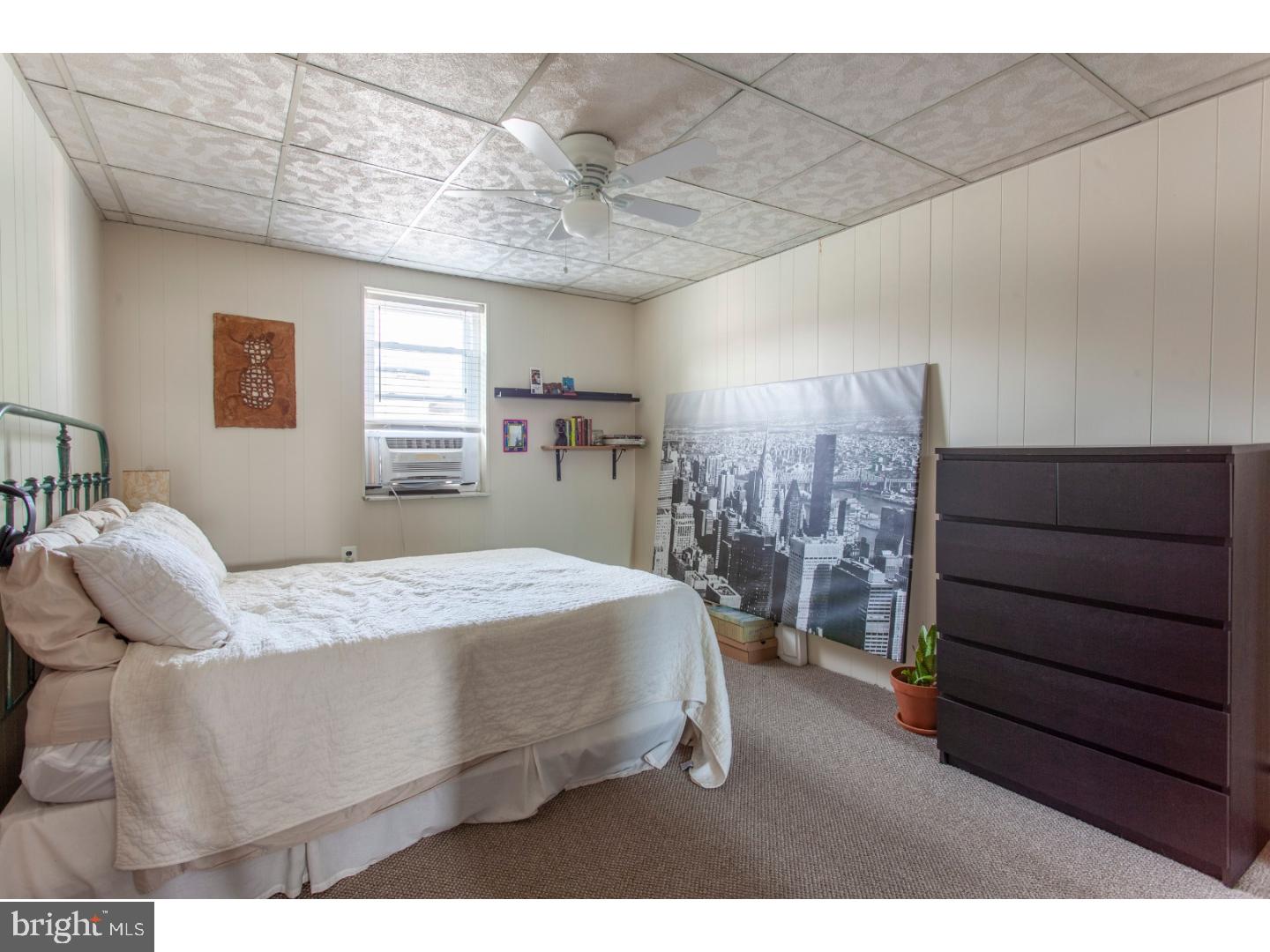 1323 Reed Street Philadelphia, PA 19147 - Photo 11 of 15 a bedroom with a bed and window