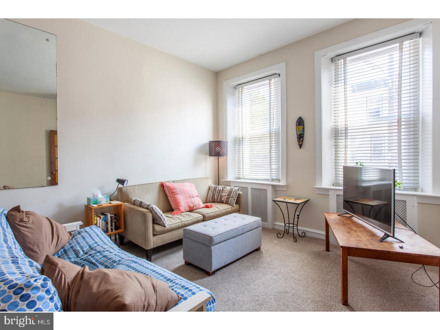 1323 Reed Street Philadelphia, PA 19147 - Photo 3 of 15 a living room with furniture and windows