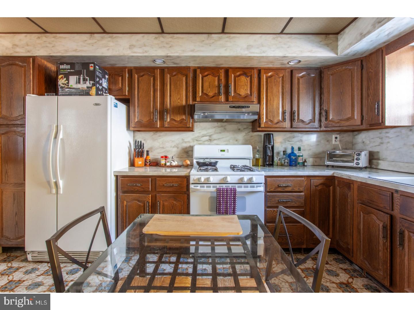 1323 Reed Street Philadelphia, PA 19147 - Photo 8 of 15 a kitchen with stainless steel appliances granite countertop a refrigerator and a stove top oven