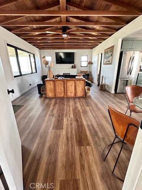 6597 Mesquite Springs Road Twentynine Palms, CA 92277 - Photo 15 of 44 a view of a room with wooden floor and furniture