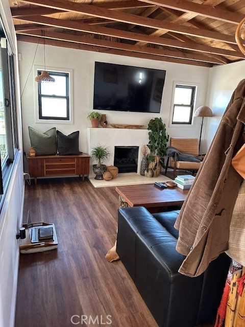 6597 Mesquite Springs Road Twentynine Palms, CA 92277 - Photo 16 of 44 a living room with furniture a flat screen tv and a fireplace