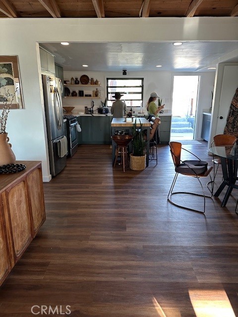 6597 Mesquite Springs Road Twentynine Palms, CA 92277 - Photo 17 of 44 a room with lots of chairs and wooden floor