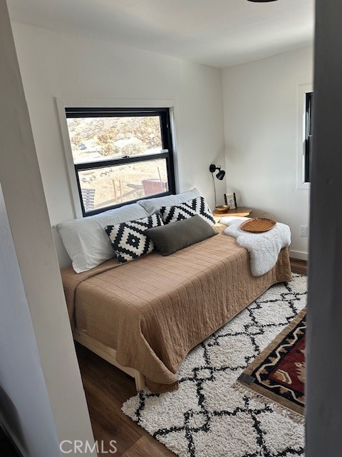 6597 Mesquite Springs Road Twentynine Palms, CA 92277 - Photo 24 of 44 a bedroom with a bed and window
