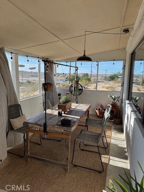 6597 Mesquite Springs Road Twentynine Palms, CA 92277 - Photo 29 of 44 a view of a dining room with furniture window and outside view