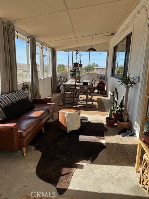 6597 Mesquite Springs Road Twentynine Palms, CA 92277 - Photo 30 of 44 a living room with furniture fireplace and large windows