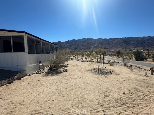 6597 Mesquite Springs Road Twentynine Palms, CA 92277 - Photo 3 of 44 a view of a backyard