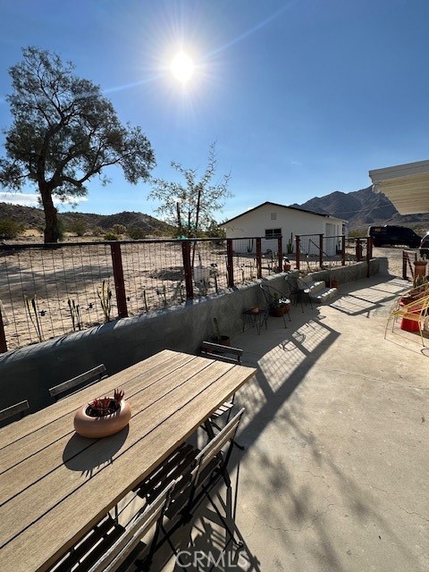 6597 Mesquite Springs Road Twentynine Palms, CA 92277 - Photo 33 of 44 a view of a patio with swimming pool