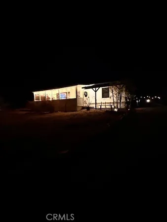 a house view with a backyard space