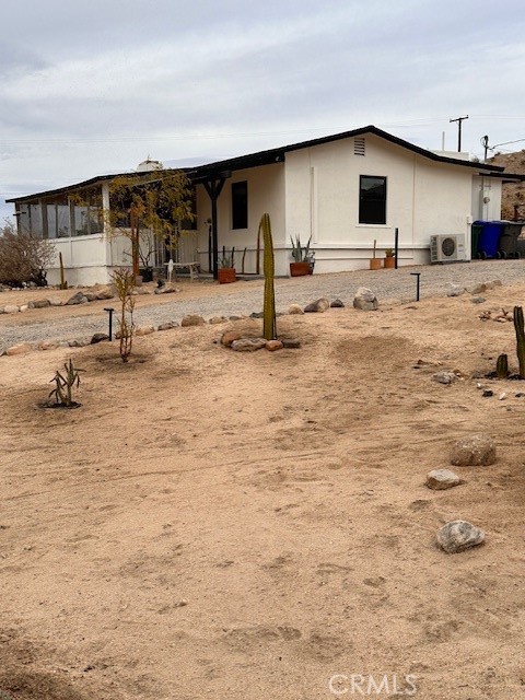 6597 Mesquite Springs Road Twentynine Palms, CA 92277 - Photo 4 of 44 a swimming pool view with a outdoor seating