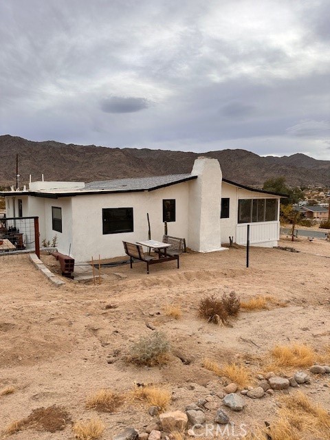 6597 Mesquite Springs Road Twentynine Palms, CA 92277 - Photo 41 of 44 a view of a house with backyard