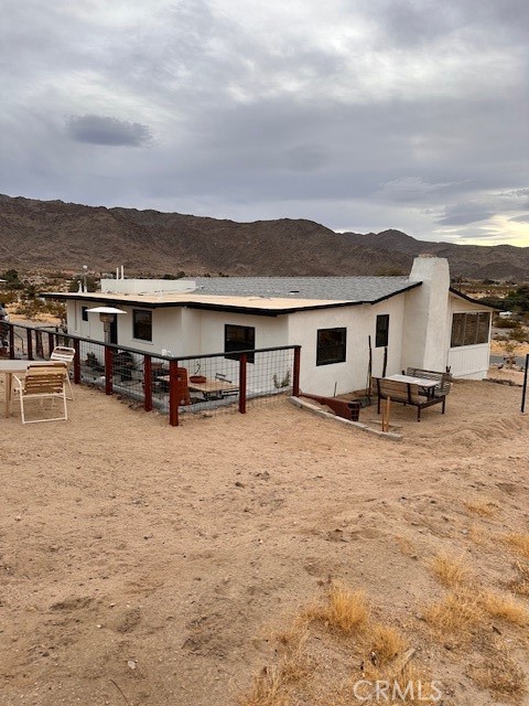 6597 Mesquite Springs Road Twentynine Palms, CA 92277 - Photo 42 of 44 a view of a terrace with chairs