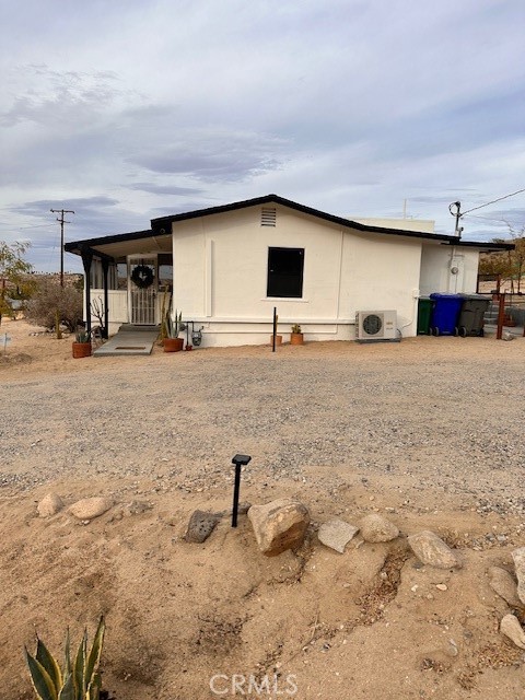 6597 Mesquite Springs Road Twentynine Palms, CA 92277 - Photo 8 of 44 a house view with a backyard space