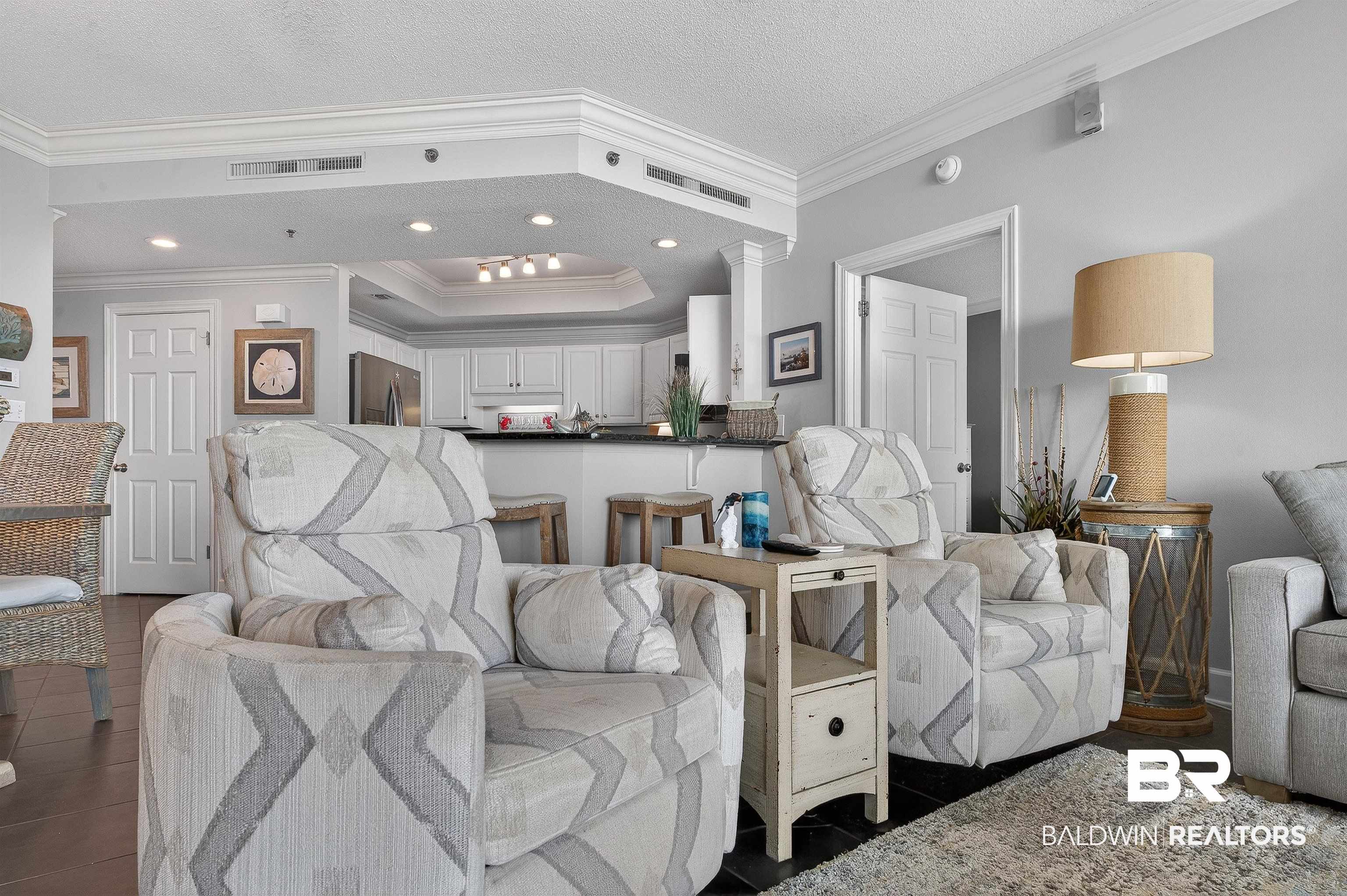 27582 Canal Road, Unit 2507 Orange Beach, AL 36561 - Photo 16 of 75 Living room featuring crown molding, a textured ceiling, and recessed lighting