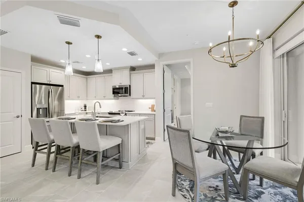 a kitchen with a stove a sink and a microwave