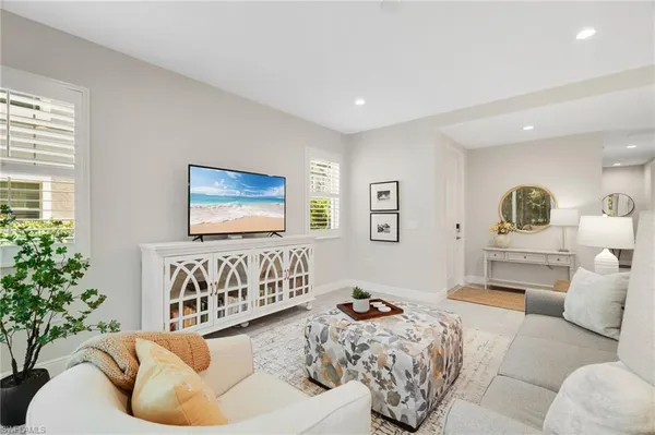a living room with furniture and windows