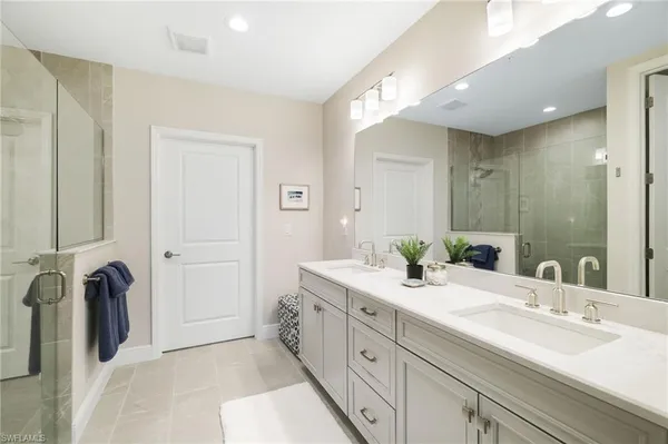 a view of a bathroom with tub and shower