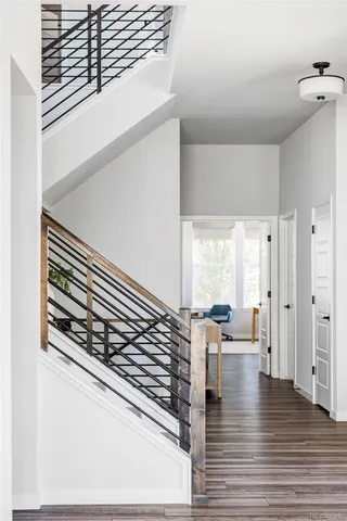 a view of a living room with hardwood floor