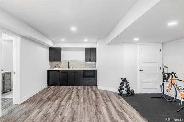 a spacious bathroom with a vanity and a mirror