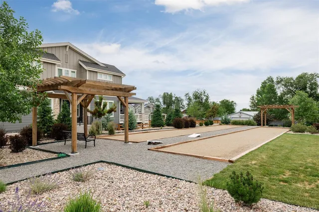 a view of a house with entertaining space and a car parked in front of it