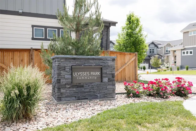 a sign that is in front of flowers