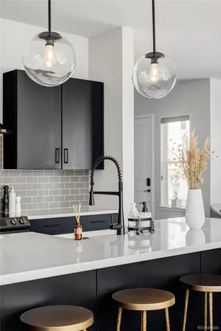 a kitchen with a table and chairs in it