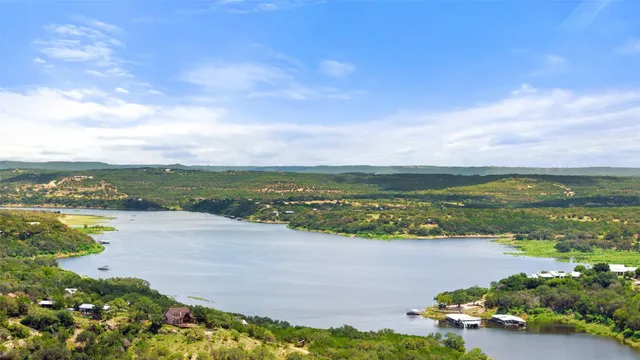 a view of a swimming pool and lounge chairs