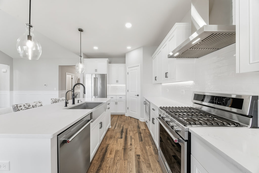 1409 Notting Hl Drive Lemont, IL 60439 - Photo 11 of 31 a kitchen with a sink a stove and a refrigerator
