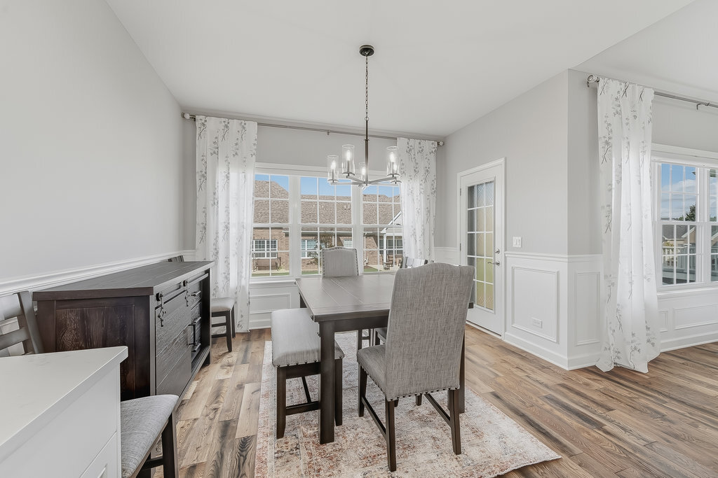 1409 Notting Hl Drive Lemont, IL 60439 - Photo 12 of 31 a view of a dining room with furniture window and wooden floor