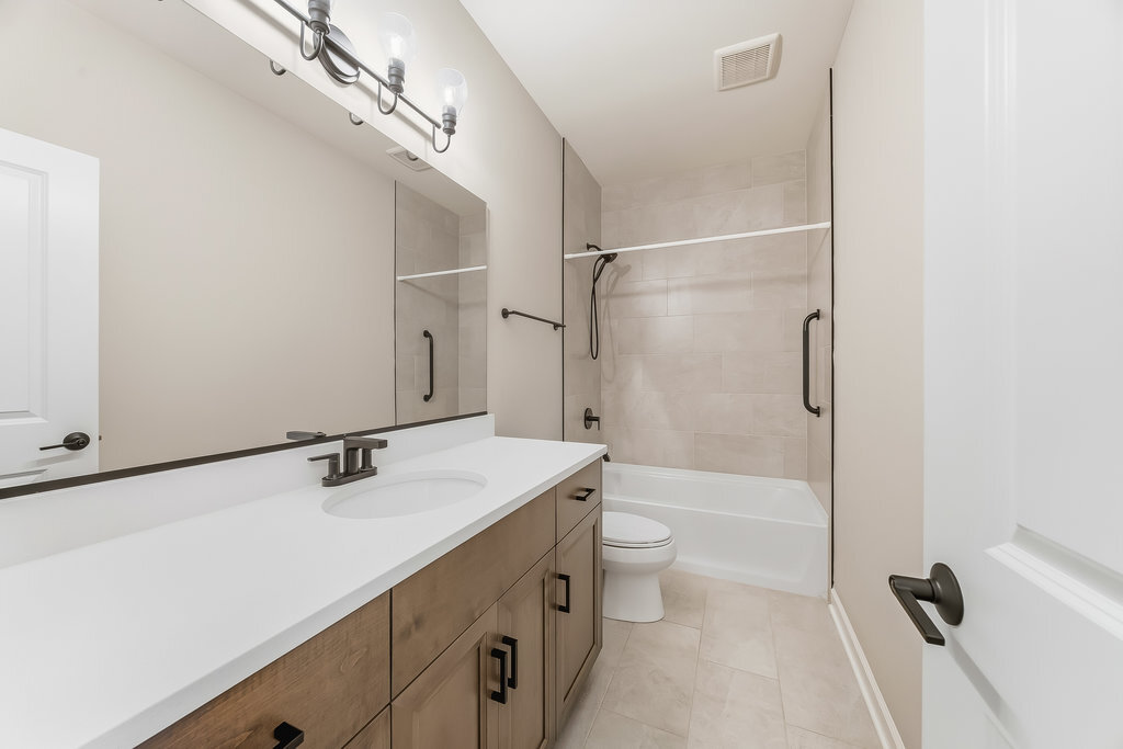 1409 Notting Hl Drive Lemont, IL 60439 - Photo 16 of 31 a bathroom with a sink a toilet and shower