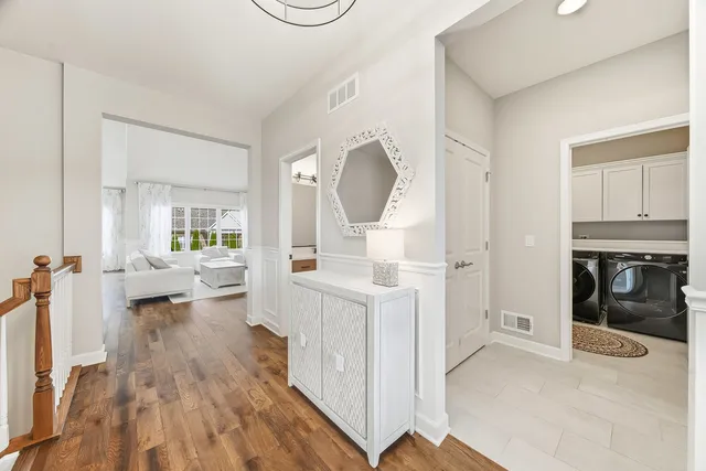 a view of living room with furniture and a fireplace