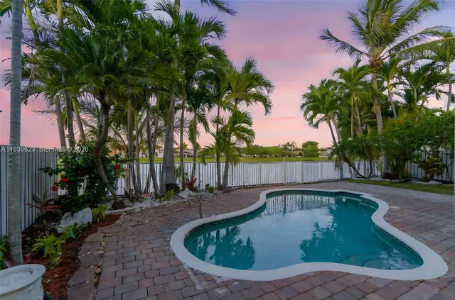 a view of a swimming pool with a patio