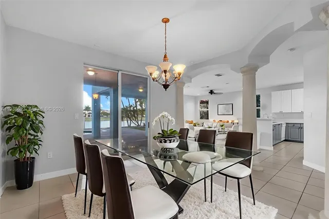 a dining room with furniture a livingroom and chandelier