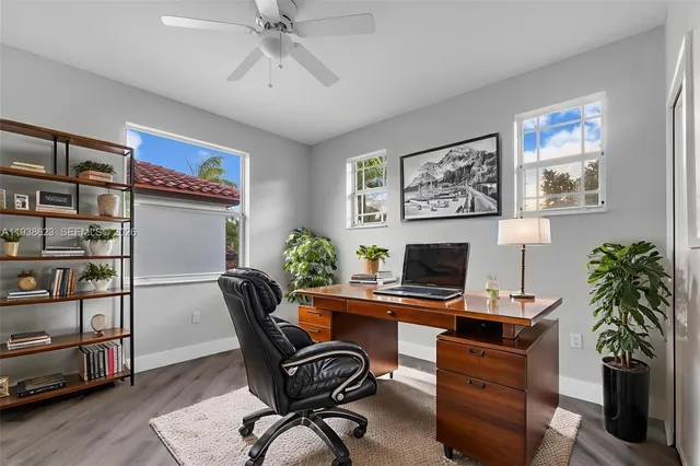 a workspace with furniture and wooden floor