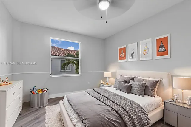 a bedroom with bed and a window