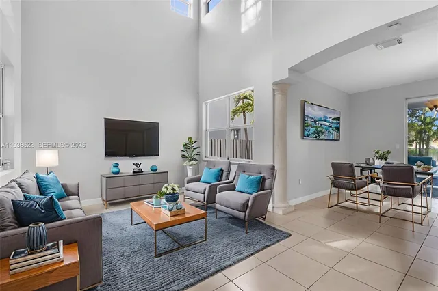 a living room with furniture and a flat screen tv