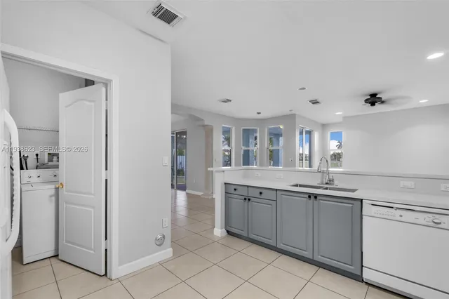 a kitchen with a sink and cabinets