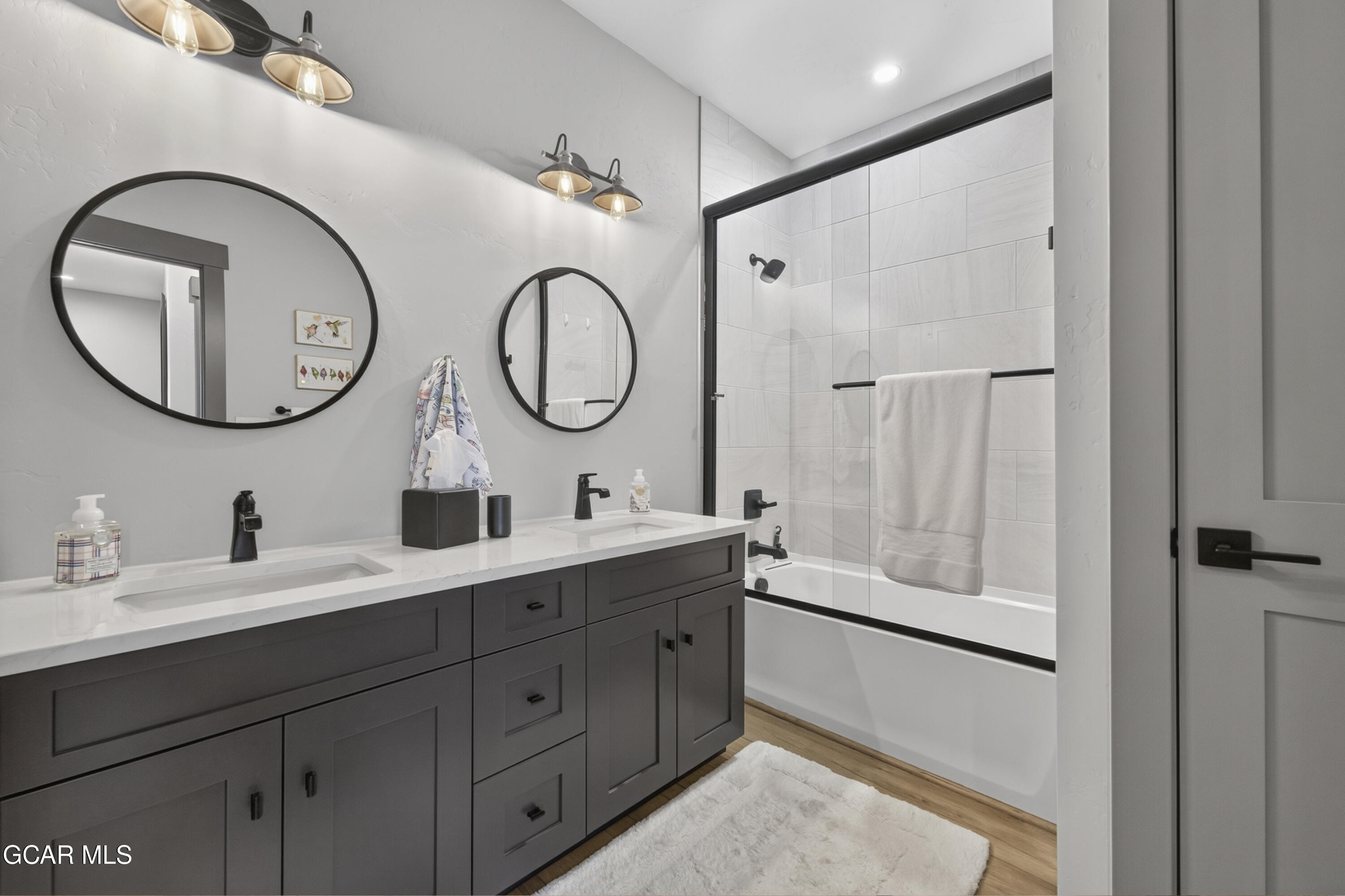 154 Eagle Ridge Drive Granby, CO 80446 - Photo 10 of 59 a bathroom with a double vanity sink and a mirror