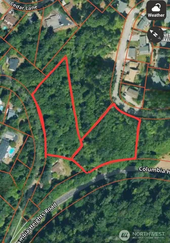 a view of a yard with swimming pool and garden