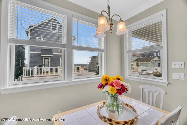 a living room with a bed furniture and a window
