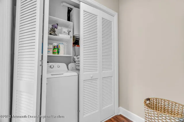 a bedroom with two beds and a large window with outer view