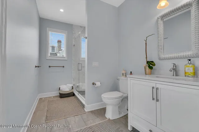 a spacious bedroom with a bed and a view of bedroom