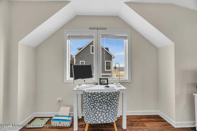 a bathroom with mirror and