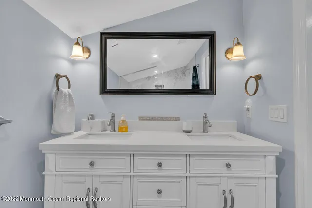 a bedroom with a bed and cabinets