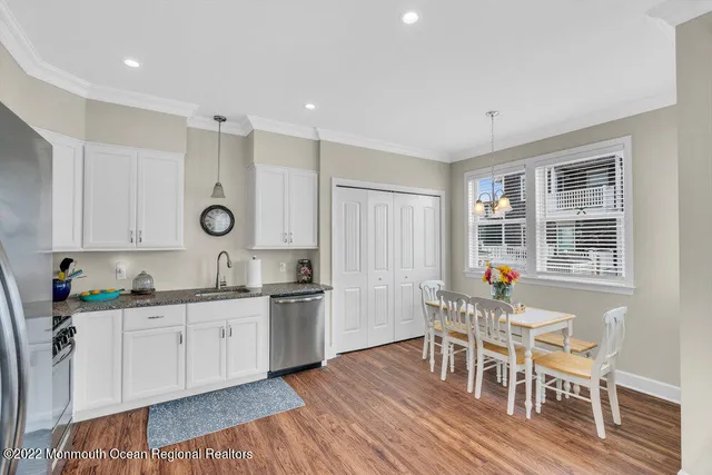 a living room with furniture and floor to ceiling windows
