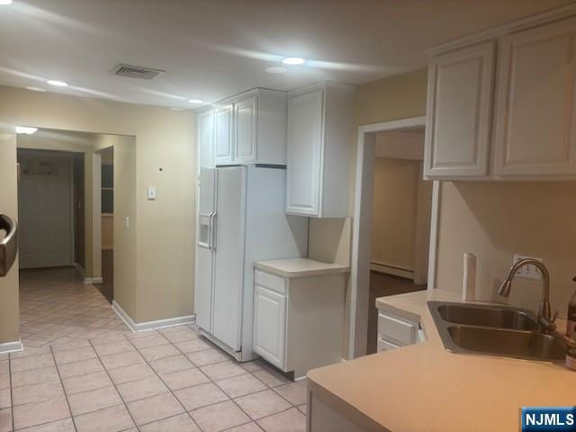 992 Ridge Court New Milford, NJ 07646 - Photo 7 of 15 a kitchen with stainless steel appliances a refrigerator and a sink