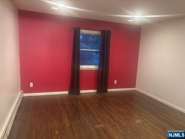 992 Ridge Court New Milford, NJ 07646 - Photo 9 of 15 a view of empty room with wooden floor